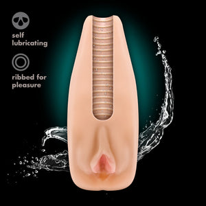 An image of the blush M Elite Natasha Soft + Wet Stroker, with a cut out view of the inside of the ribbed canal, with a splash of water coming out from the bottom. Product feature icons for: self lubricating; ribbed for pleasure.