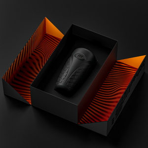 Top view of an open package for the blush M For Men Platinum Gript Platinum-Cured Silicone Stroker, with the product laying inside.