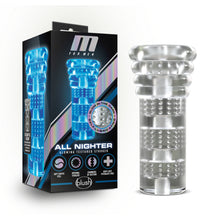 Load image into Gallery viewer, Product packaging standing beside the the All Nighter stroker. On the left side of the product packaging is the All Nighter stroker. On the front of the packaging is the M for Men logo, a side-view image of the stroker, product feature icons for: Glow in the dark; Self-Lubricating; Soft Erotic feel; Internal ticklers; Chambers of suction; Body safe; phthalate free, product name: All Nighter Glowing textured stroker, and below is the blush logo.