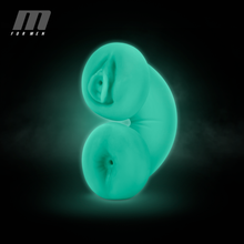 Load image into Gallery viewer, blush M For Men Soft + Wet Double Trouble Delight Glow Stroker glowing in the dark, on the top right is the M for Men logo.
