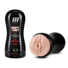 Load image into Gallery viewer, On the left side of the image is the product packaging for M For Men Soft + Wet Pussy With Pleasure Ridges And Orbs Self lubricating Stroker by blush. Beside the Product packaging is the open stroker showing the insertion part of the product, laying flat on its side.