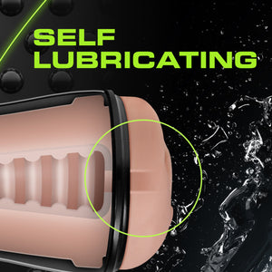 Self Lubricating, with front end of the blush M For Men Soft + Wet Pussy With Pleasure Ridges Self Lubricating Stroker, with water splashes around it, indicating lubrication.