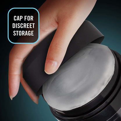 A female hand is holding the cap for the blush M For Men Torch Joyride Male Masturbator, partly showing inside, with caption: Cap for discreet storage.