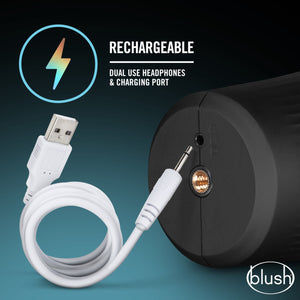 An icon for Rechargeable - Dual use headphones & charging port. A close up to the back of the blush M For Men Torch Joyride Male Masturbator, showing where to insert the USB charging cable. In the bottom right of the image is the blush logo.