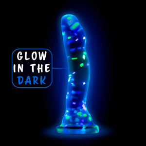 blush Neo Elite Hanky Panky 7.5 Inch Silicone Glow In The Dark Dildo glowing in the dark, with descriptive text: Glow In the dark, pointing to the product.