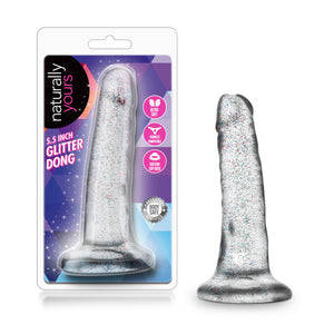 On the left side of the image is the product packaging. On the packaging is the naturally yours logo, product name: 5.5 Inch Glitter Dong, in the middle is the product visible through clear packaging, and on right side are product feature icons for: Ultra soft; Harness compatible; Suction cup base; Laboratory certified - Body safe. Beside the packaging is the product, blush Naturally Yours 5.5 Inch Glitter Dong, standing on its suction cup base.