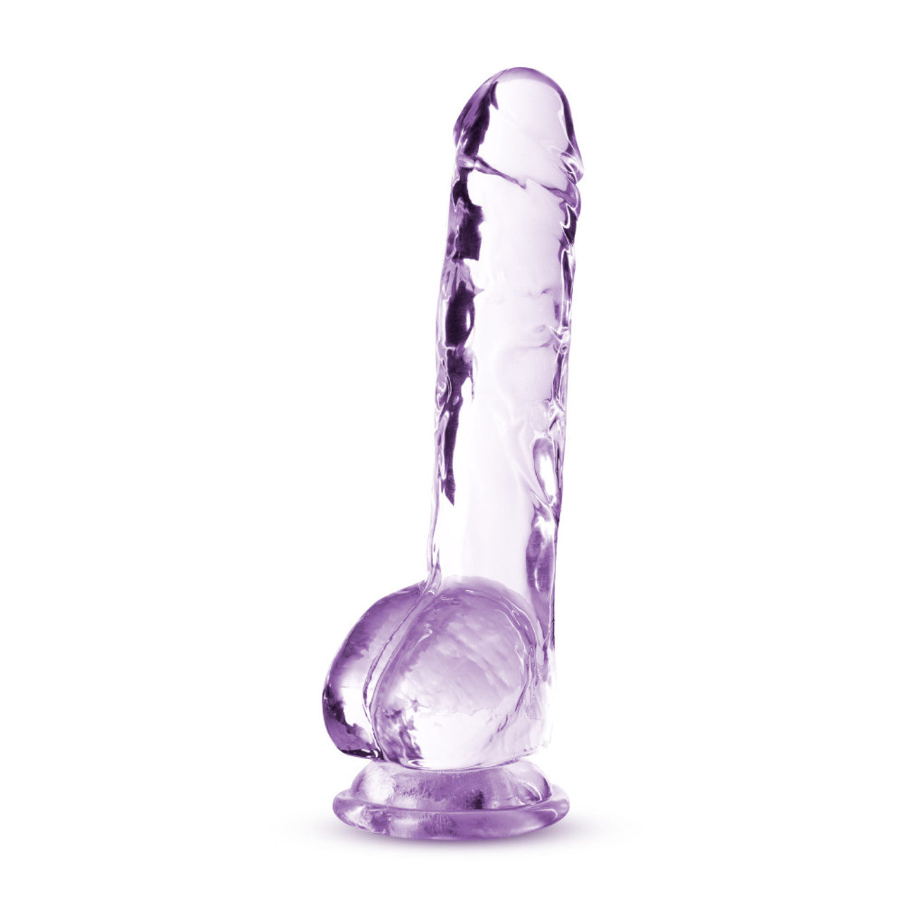 Bottom side view of the blush Naturally Yours 8 Inch Crystalline Dildo, placed on its suction cup base.