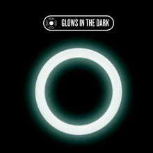 Load image into Gallery viewer, An icon for Glows in the dark, with the blush Performance Silicone Glo Cock Ring glowing in the dark.