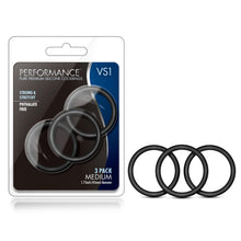 Load image into Gallery viewer, On the left side of the image is the product packaging. On the packaging is the Performance logo, product name: VS1 Pure premium Silicone Cock Rings, product features: strong &amp; stretchy; Phthalte free, the product visible through clear packaging, and at the bottom right &quot;3 Pack Medium 1.7 inch (45mm) diameter&quot;. Beside the packaging is the product.