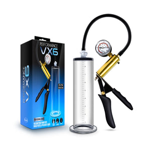 On the left side of the image is the product packaging. On the left side of packaging is Performance & blush logos, and product name VX6. On the front of the packaging is the Performance logo, Product name: VX6 Vacuum Penis Pump with Brass Pistol & Pressure Guage, an image of the product with measurements displayed: 9"L x 2"W / 22.9 cm x 5.1 cm, "Proffessional Grade", and product features at the bottom. Beside the packaging is the product standing from the base of the cylinder.