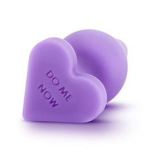 Load image into Gallery viewer, Back top side of the blush Play With Me Naughty Candy Hearts Do Me Now Anal Plug, with &quot;Do me now&quot; written at the bottom of the base.