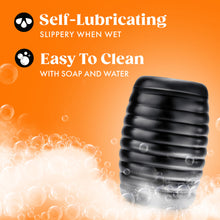 Load image into Gallery viewer, Feature icons for: Self-Lubricating slippery when wet; Easy to clean with Soap and Water. On the right side is the stroker standing up soap bubbles effect underneath and across to the left side.