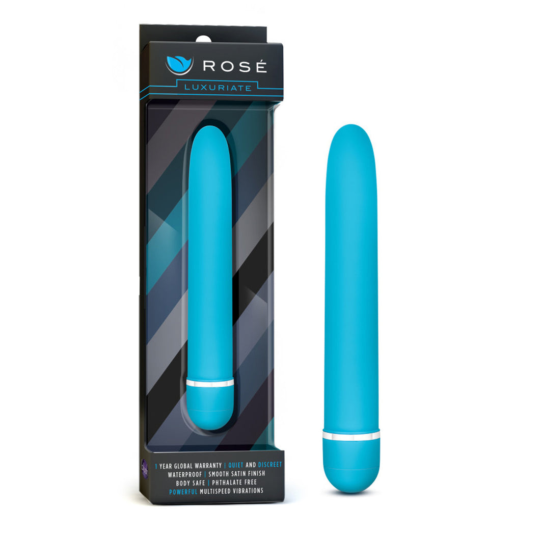On the left side of the image is the product packaging. On the packaging is the Rose logo, product name: Luxuriate, the blue variant of the product inside visible through clear packaging, and product features at the bottom: 1 YEAR GLOBAL WARRANTY; QUIET AND DISCREET; WATERPROOF; SMOOTH SATIN FINISH; BODY SAFE; PHTHALATE FREE; POWERFUL MULTISPEED VIBRATIONS. Beside the packaging is the product, blush Rose Luxuriate blue Vibrator, standing on the bottom of its cap.