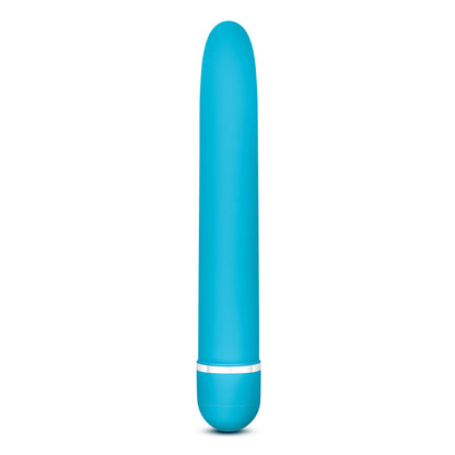 Side view of the blush Rose Luxuriate blue Vibrator, standing on the bottom of it's battery cap.