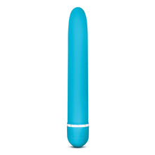 Charger l&#39;image dans la galerie, Side view of the blush Rose Luxuriate blue Vibrator, standing on the bottom of it&#39;s battery cap.