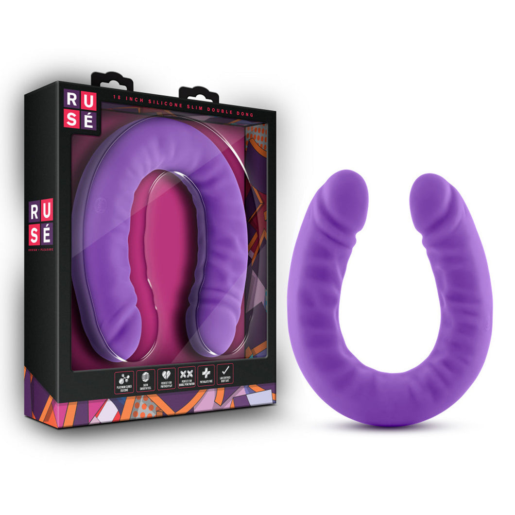 On the left side of the image is the product packaging. On the left side of packaging is the Ruse logo. On the front of the packging is the Ruse logo, product name: 18 Inch Silicone Slim Double Dong, the product fully visible through clear packaging, and on the bottom are product feature icons for: Platinum cured silicone; Satin smooth feel; Ideal for double penetration; Phthalate free; Lab certified - Body safe. Beside the packaging is the product, standing on its U-Shape.