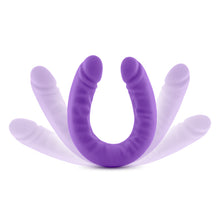 Load image into Gallery viewer, Side view of the blush Ruse 18 Inch Silicone Slim Double Dong, standing on it&#39;s u-shape, illustrating both ends stretching lower, with an opacity effect, demonstrating the flexibility of the product.