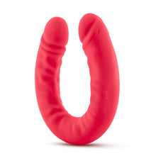 Load image into Gallery viewer, Bottom side view of the blush Ruse Silicone Thick Double Headed Dildio, while standing on the centre of its U-Shape.