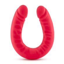 Load image into Gallery viewer, Side view of the blush Ruse Silicone Thick Double Headed Dildio, while standing on the centre of its U-Shape.