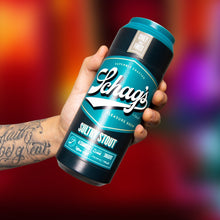 Load image into Gallery viewer, A hand holding the blush Schag&#39;s Sultry Stout Beer Can Stroker from the back showing a size scale of the product.