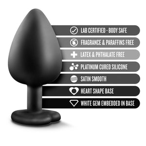 blush Temptasia Bling Plug features: LAB CERTIFIED - BODY SAFE; FRAGRANCE & PARAFFINS FREE; LATEX & PHTHALATE FREE; PLATINUM CURED SILICONE; SATIN SMOOTH; HEART SHAPE BASE; WHITE GEM EMBEDDED IN BASE.