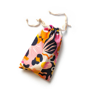 Stuffed blush The Collection Burst Cotton Toy Bag laying horizontal on a surface.