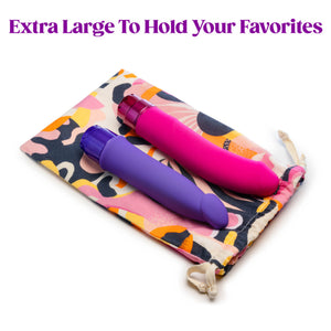 Extra Large to hold your favorites. The blush The Collection Burst Cotton Toy Bag laying flat with two Vibrators laying on top of it, showing the size scale difference of the toy bag.