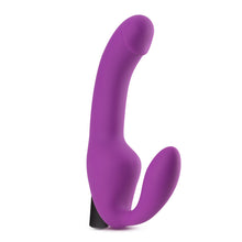 Load image into Gallery viewer, Bottom side of the blush Temptasia Cyrus Strapless Dildo, standing on its base.