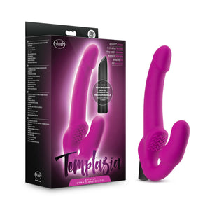 On the left side of the image is the product packaging. On the front packaging is the blush & Temptasia logos, images of the Strapless Dildo & the Bullet Vibe with text "InCLUdes the BESTSELLING SUPER POWERFUL, RECHARGEABLE NOCTURNal VIBEI", product features: Ultrasilk silicone; 10 vibrating functions; Deep rumbly vibrations; Magnetic Recharging; Phthalate free; IPX7 waterproof, and at the bottom product name: Estella Strapless Dildo. Beside the packaging is the product standing on its base.
