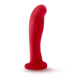 Top side view of the blush Temptasia Jezebel Dildo, placed on its suction cup base.