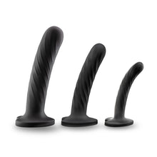 Load image into Gallery viewer, Side view of the blush Temptasia Twist Kit dildos, standing on their suction cup base from large to small.