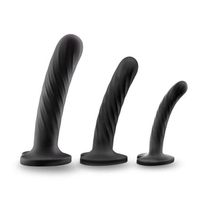Side view of the blush Temptasia Twist Kit dildos, standing on their suction cup base from large to small.