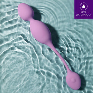 blush Wellness Raine Vibrating Kegel Ball laying in water with the wireless remote control. In the top right is a feature icon for IPX7 Waterproof.