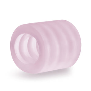 blush X5 Men Goin' Down BJ Stroker laying on its side, with the ribbed pattern visible from inside and outside of the product.
