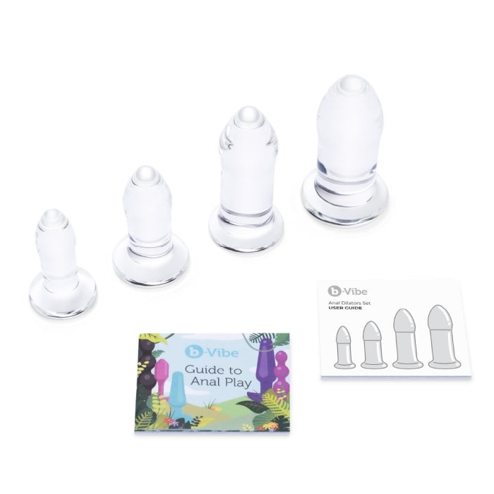 Image of the included items of the b-Vibe Anal Dilators 4-Piece Glass Plug Set: the 4 piece glass anal plugs, b-Vibe guide to Anal Play, and the user guide.