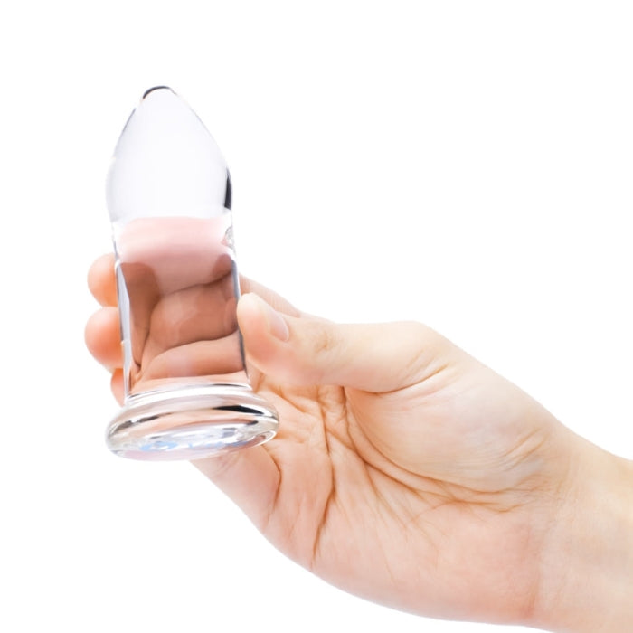 Close-up of the b-Vibe Anal Dilator Medium Glass Plug being held.