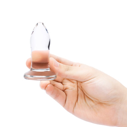 Close-up of the b-Vibe Anal Dilator Small Glass Plug being held.