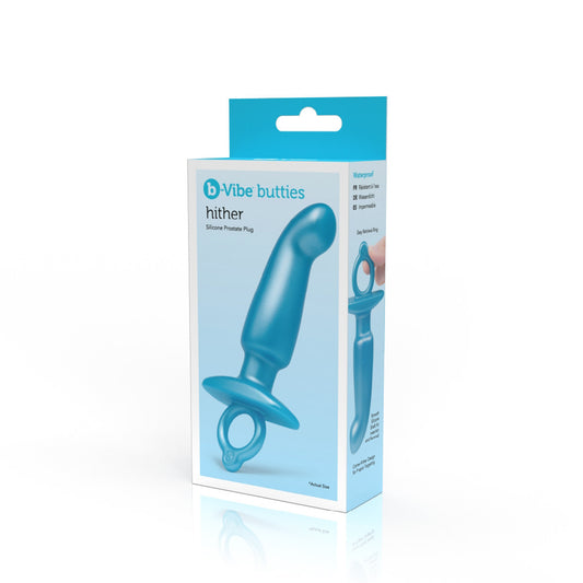 On the front of the packaging are the b-Vibe and butties logos, product name: Hither Silicone Prostate Plug, and actual sized image of the product. On the right side of the packaging are product features: Waterproof; Easy retrieval ring; Smooth silicone shaft for insertion and removal; Come-Hither design for P-Spot targetting, and an image of the product being held by the ring handle.