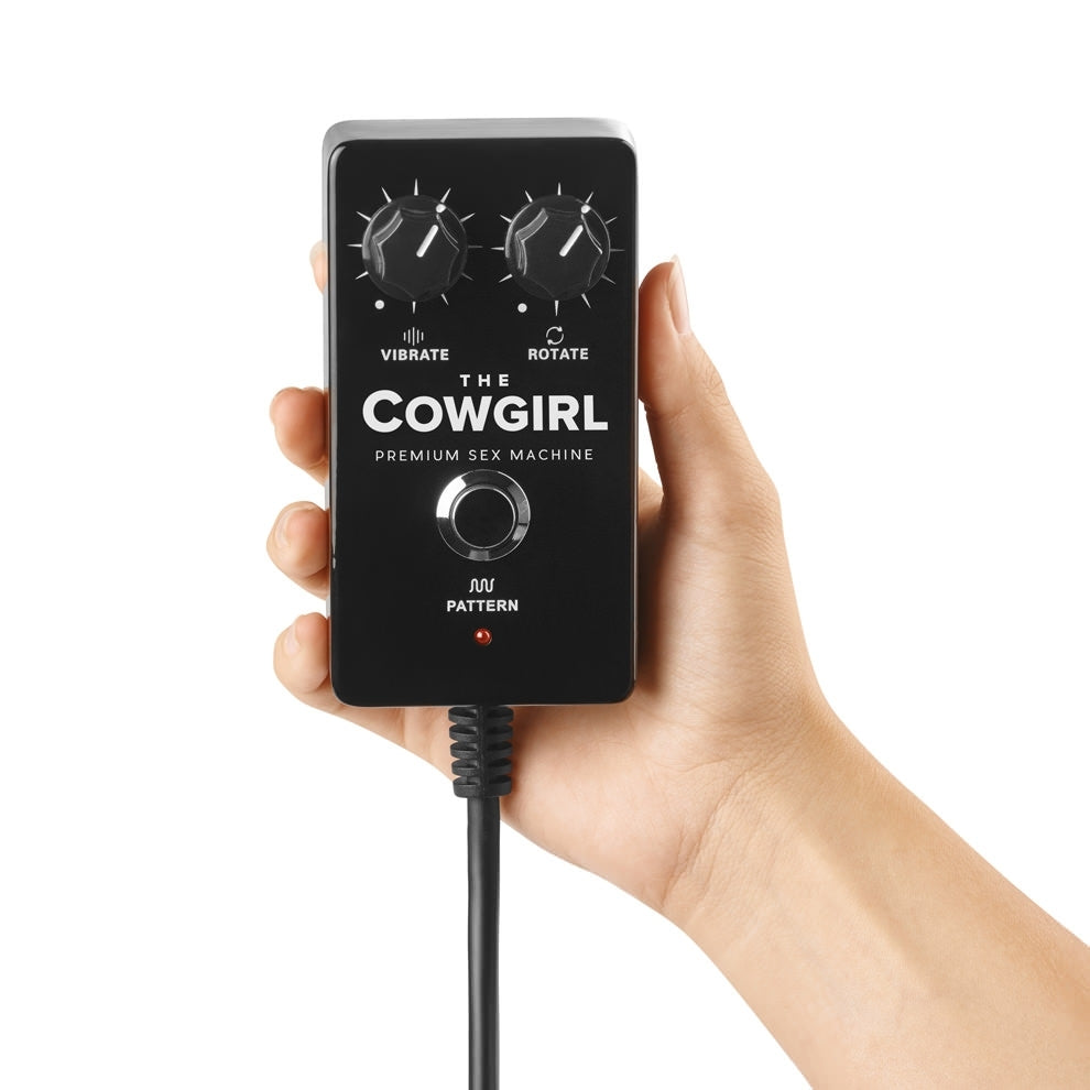 Image of the b-Vibe The Cowgirl Sex Machine's remote controller being held, showing the size scale of the controller.