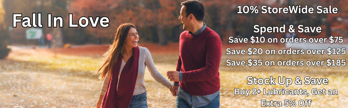 Promotional banner featuring a smiling couple holding hands in an autumn park. Text reads: "Fall In Love. 10% StoreWide Sale. Spend & Save: Save $10 on orders over $75, Save $20 on orders over $125, Save $35 on orders over $185. Stock Up & Save: Buy 2+ Lubricants, Get an Extra 5% Off."