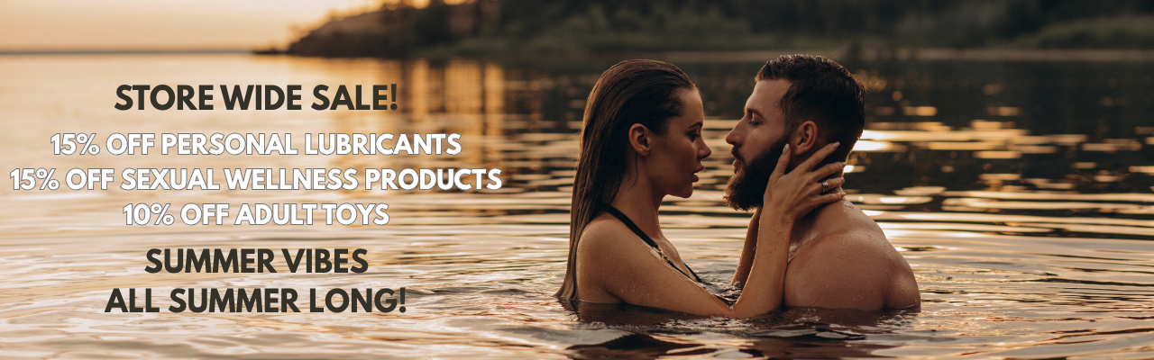 Couple embracing in water with promotional text overlay "Store Wide Sale! 15% off personal lubriants; 15% off Sexual Wellness products; 10% off Adult Toys. Summer Vibes All Summer Long"