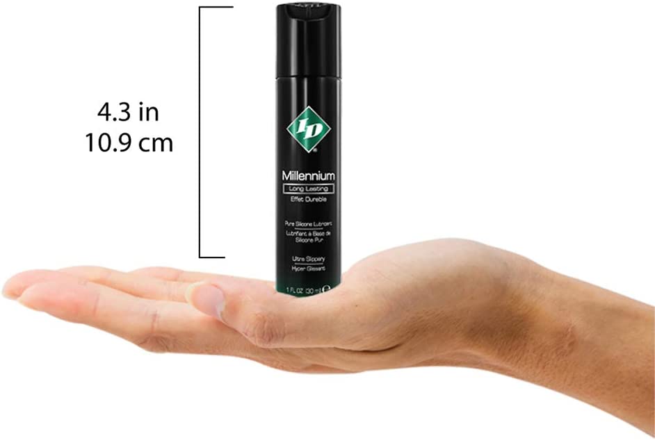 ID Millennium Long Lasting Pure Silicone Lubricant Ultra slippery 1 fl oz (30 ml) bottle height: 4.3 inches / 10.9 centimetres standing on the palm of a hand for size reference.