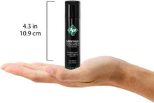 Load image into Gallery viewer, ID Millennium Long Lasting Pure Silicone Lubricant Ultra slippery 1 fl oz (30 ml) bottle height: 4.3 inches / 10.9 centimetres standing on the palm of a hand for size reference.