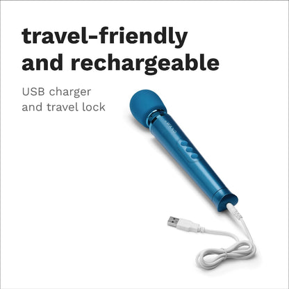 An image of the Le Wand Petite Blue Massager with a USB charging cable inserted in the charging port. Above is a caption "Travel-Friendly and rechargeable, USB charger and travel lock".