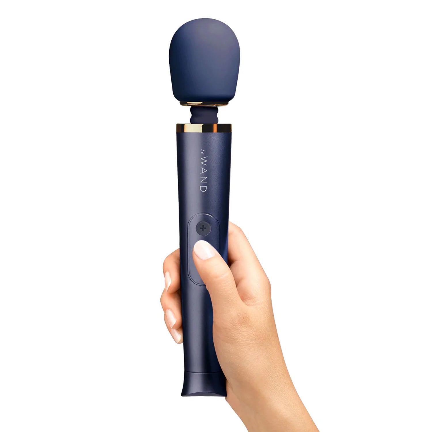 Le Wand Petite Navy Massager being held showing the size scale of the product compared to a human hand