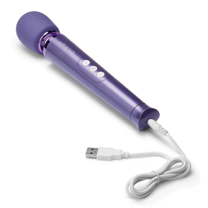 Back side view of Le Wand Petite Violet Massager with the USB charging cable inserted in the charging port.