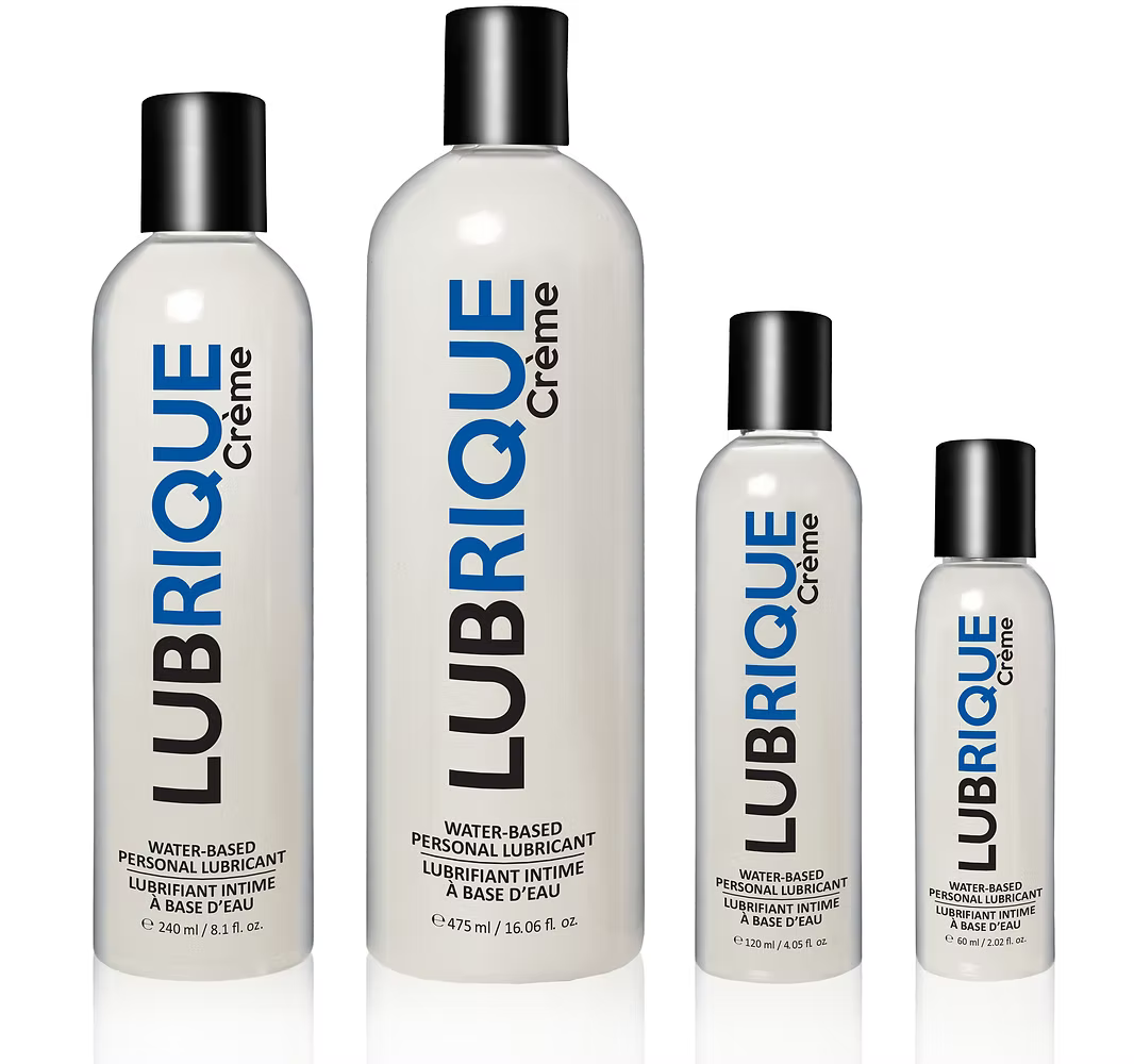 A professional group shot of four Lubrique Crème water-based personal lubricant bottles in 60 ml / 2 oz, 120 ml / 4 oz, 240 ml / 8 oz, and 475 ml / 16 oz sizes, showcasing the clean white branding and black flip-top caps.
