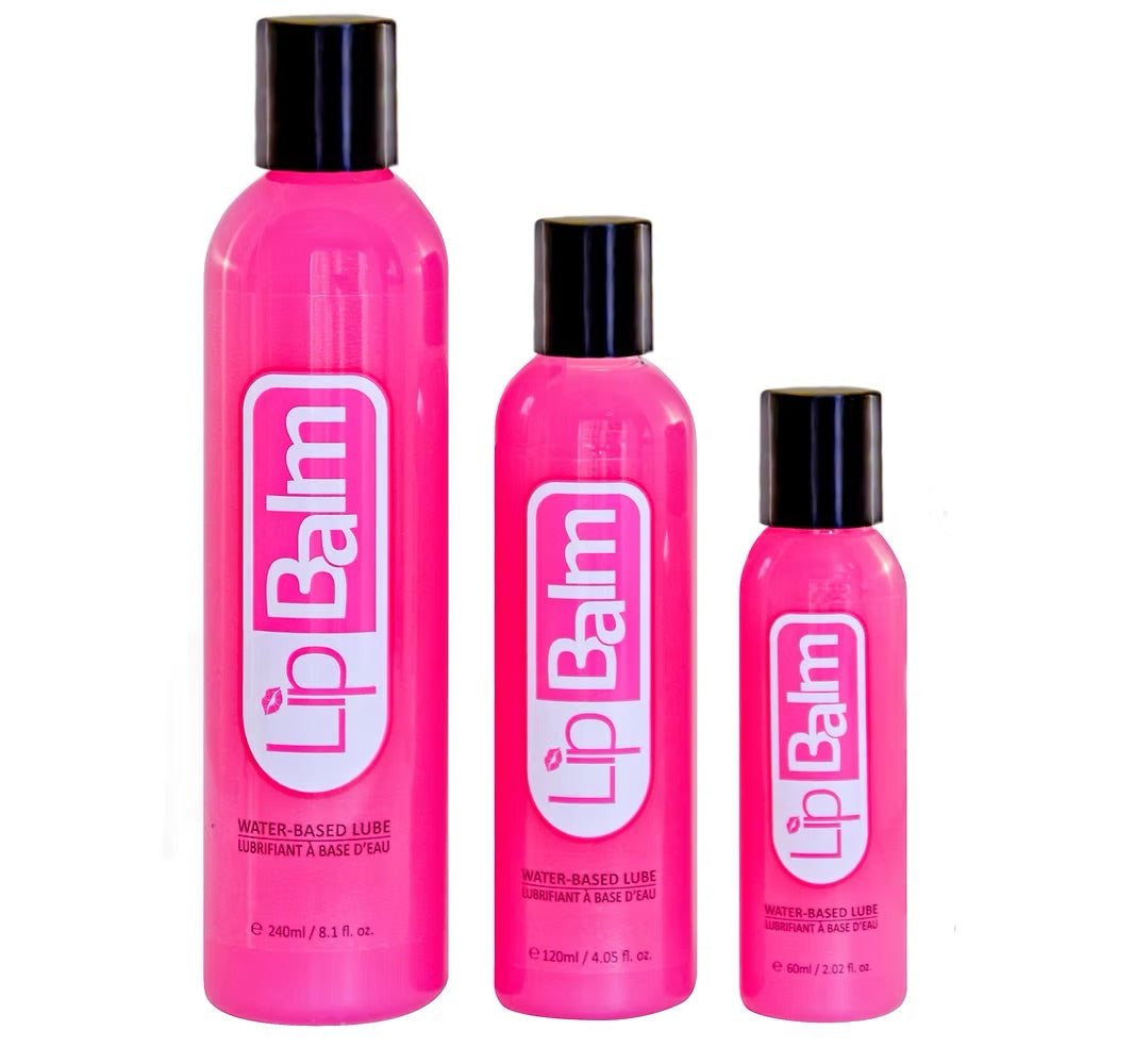 A trio of LipBalm water-based personal lubricant bottles in three sizes (60 ml / 2 oz, 120 ml / 4 oz, and 240 ml / 8 oz) featuring vibrant hot pink packaging and black caps on a white background.