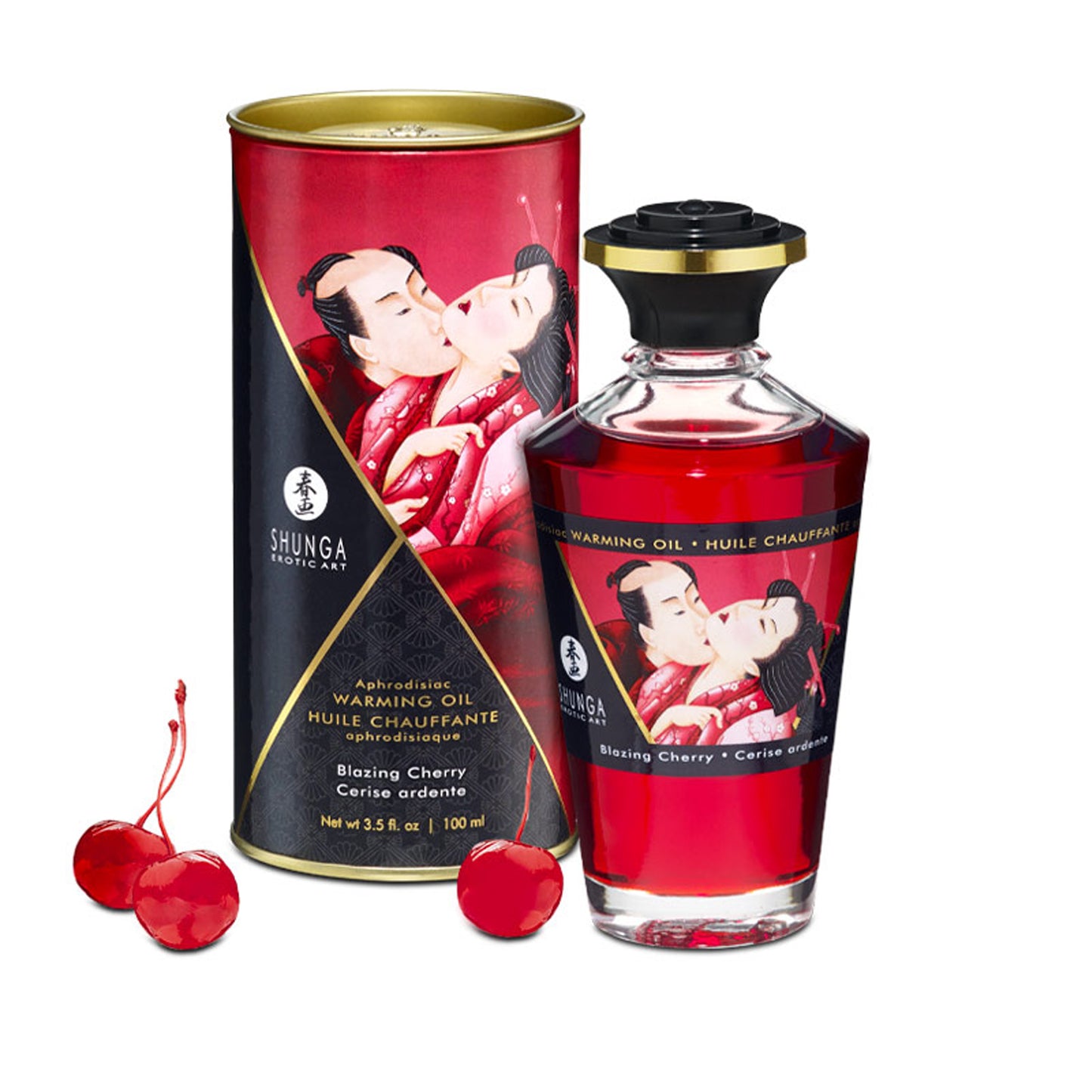 Shunga Blazing Cherry Warming Oil bottle and its decorative red storage tin, displayed with fresh cherries to highlight the edible flavour.