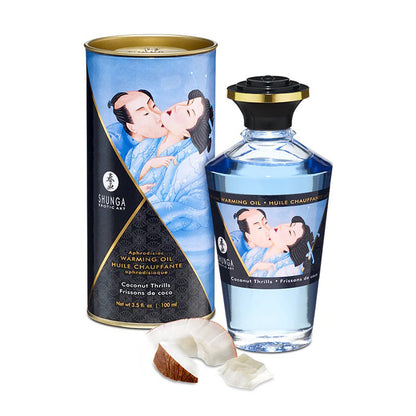 Shunga Coconut Thrills Warming Oil bottle in a light blue theme, pictured with fresh coconut pieces for a tropical aesthetic.